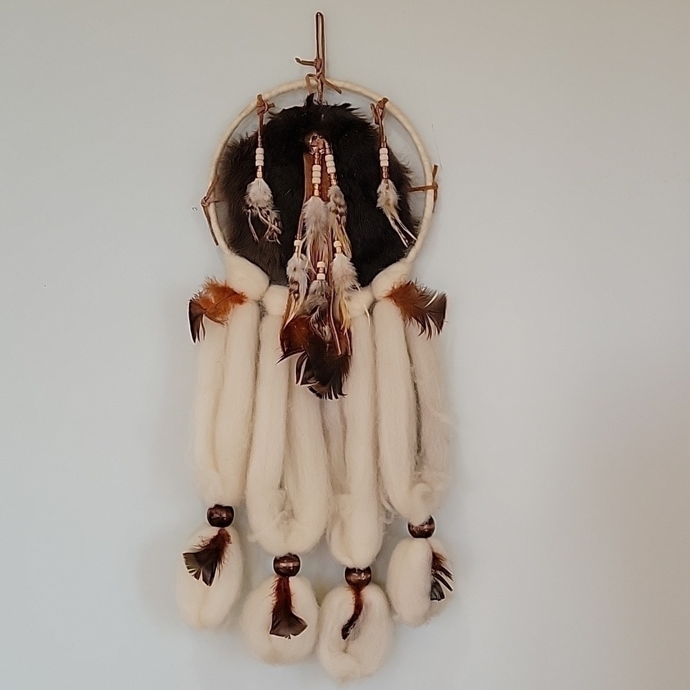 Dreamcatcher rabbit fur, feathers, beads, wool, and leather.  Wall hanging.